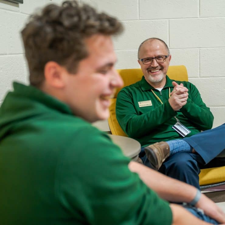 Mark Gronski chats with a student