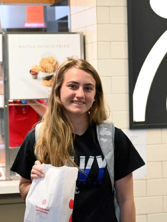 A student picks up her lunch from Chick-fil-A