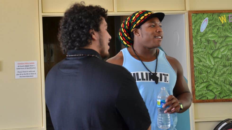 Two students in the Cumberland Hall lobby