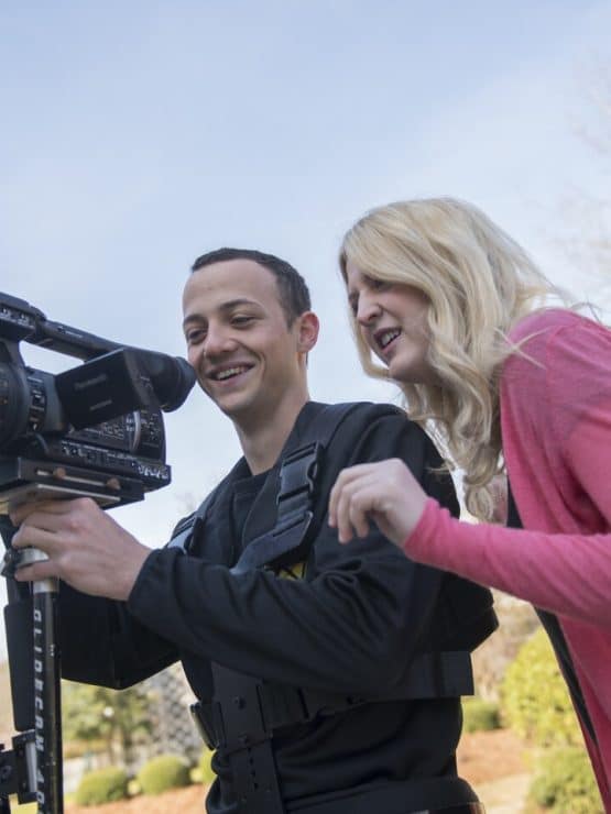 Students with a video camera