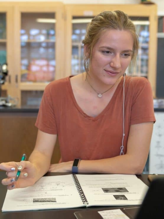 A student works in biology lab