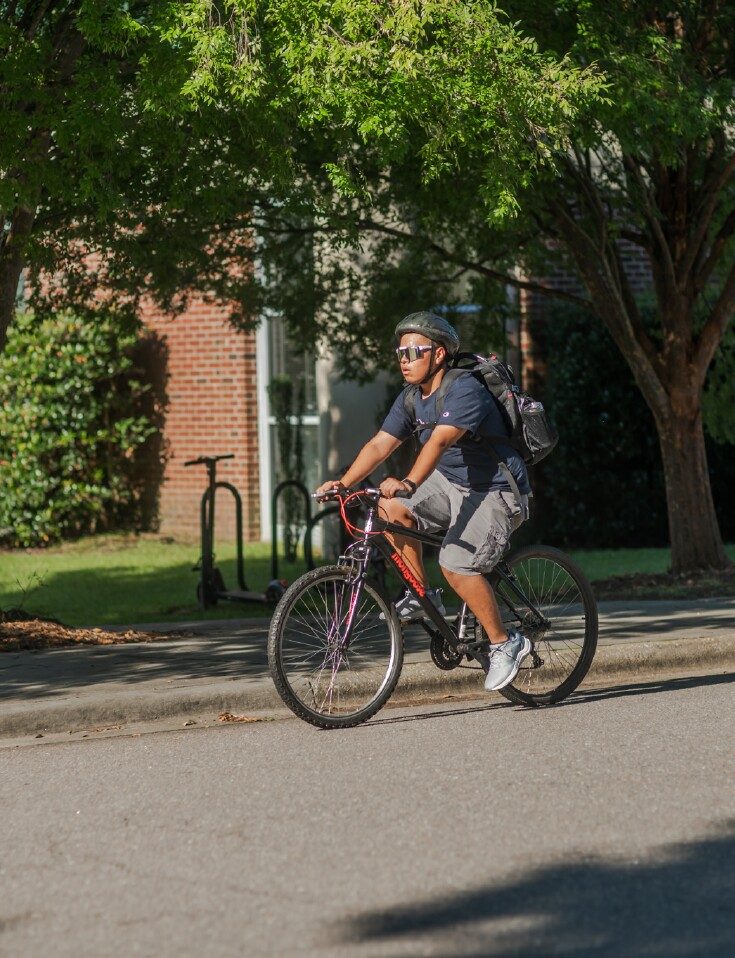 Student biking to Class