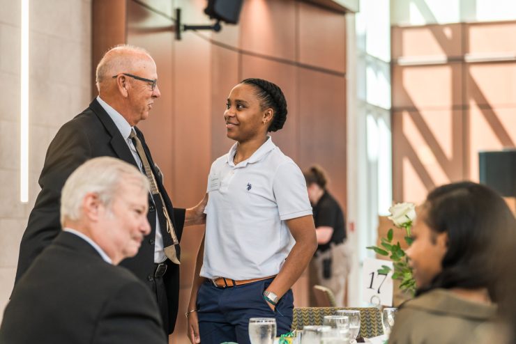 A student meets with a donor