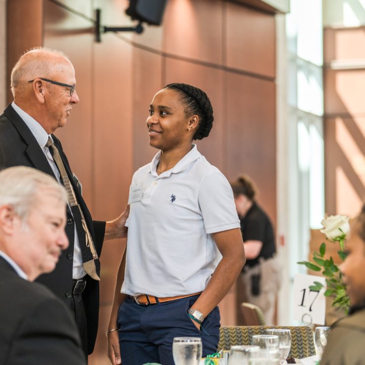 A student meets with a donor