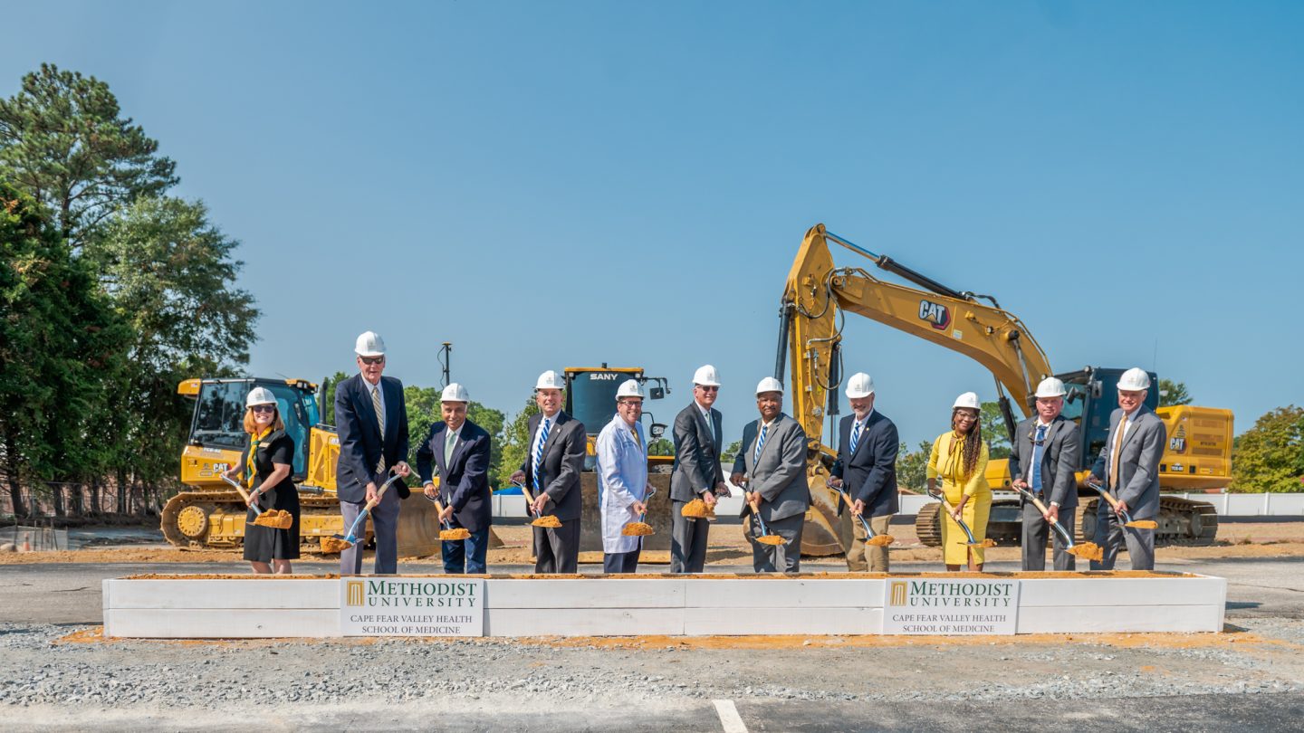 The speakers at Tuesday's groundbreaking included (L-R) Dr. Suzanne Blum Malley (Provost, Methodist University); Dr. Franklin Clark III (Chair, Methodist University Cape Fear Valley Health School of Medicine, Inc.); Dr. Rakesh Gupta (Board Chair, Methodist University); Michael Nagowski (CEO, Cape Fear Valley Health); Dr. Hershey Bell (Founding Dean, Methodist University Cape Fear Valley Health School of Medicine); Dr. Stanley T. Wearden (President, Methodist University); Glenn Adams (Chair, Cumberland County Commissioner and Board Member, Cape Fear Valley Health); Jimmy Keefe (Cumberland County Commissioner and Vice Board Chair, Cape Fear Valley Health); Dr. Toni Stewart (Vice Chair, Cumberland County Commissioner and Board Member, Cape Fear Valley Health); Brian Raynor (Golden LEAF Foundation); Scott Hamilton (Golden LEAF Foundation)