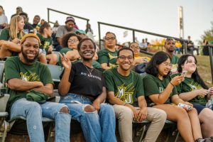 Students attend the Homecoming Football game