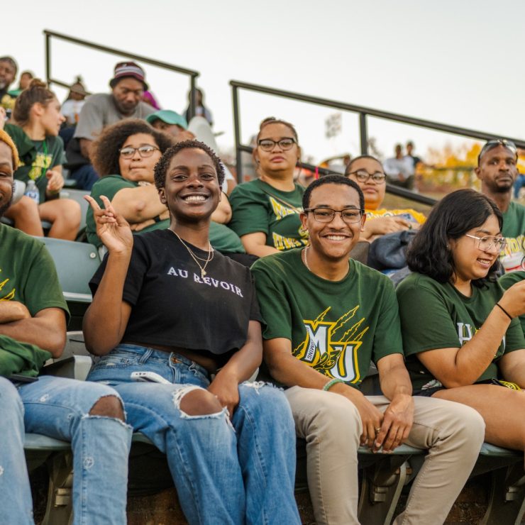 Students attend the Homecoming Football game