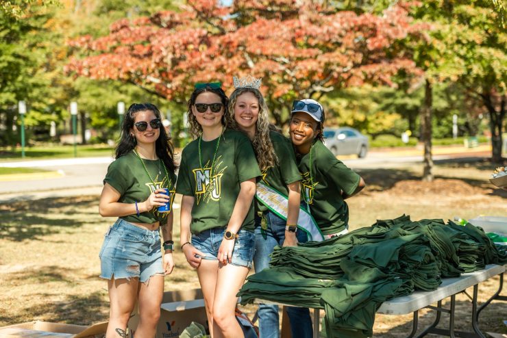 Students at a Homecoming tailgate