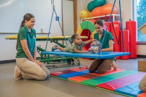 Occupational Therapy students work with child